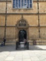 The entrance to the Divinity School with the statue of the Earl of Pembroke in the schools quadrangle