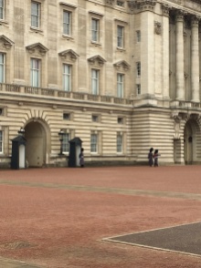 Two Guards marching along Buckingham Palace for changing of their duty