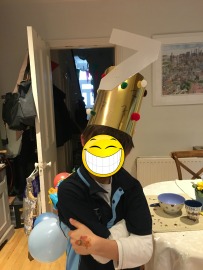 The birthday boy with his crown