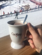 Enjoying a caotina hot chocolate while looking after the children
